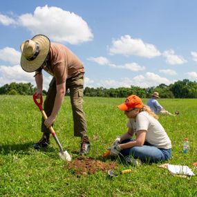 Students shovel testing land at Camp Watts
