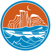 Icon with a boat in a blue river and an orange canyon in the background