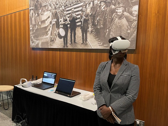 Tracie Todd with VR headset participating in Selma exhibit