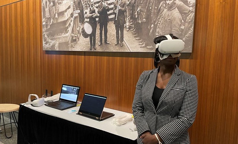 Tracie Todd with VR headset participating in Selma exhibit