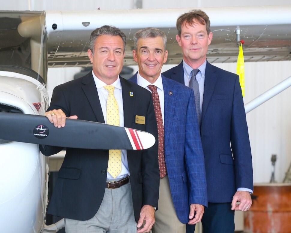 Southern Union State Community College President Todd Shackett, Auburn airport director Bill Hutto and Auburn School of Aviation director James Birdsong pose for photo in hangar