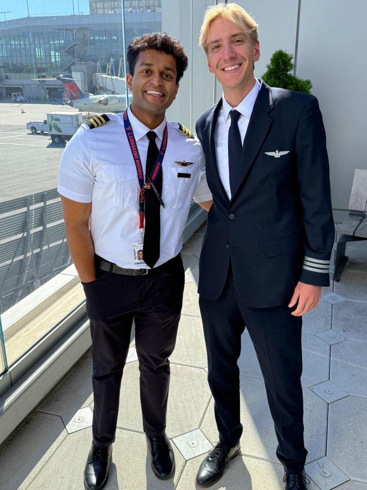 Push Saha and Tristan Lines in pilot uniforms at the airport