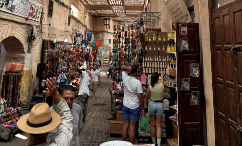 People shopping in a colorful marketplace