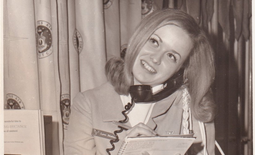 A young Linda Lee answering the phone for Angel Flight