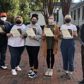Group of students holding certificates