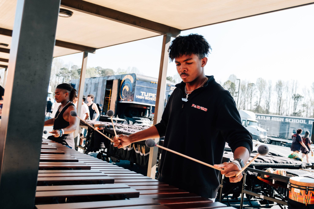 Student composer Josh Boyd playing an instrument