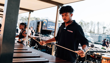 Student composer Josh Boyd playing an instrument