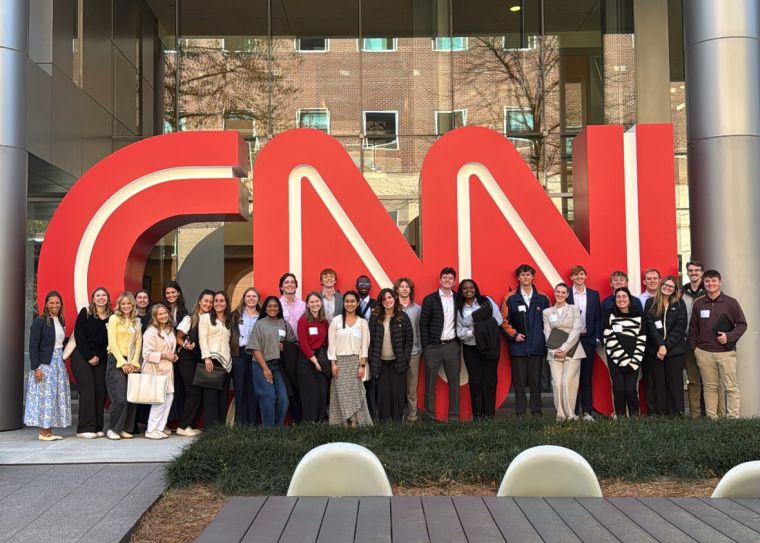 Group of students standing in front of CNN sign