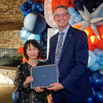 Dr. JungMoon Hyun receiving an award from Dean Jason Hicks