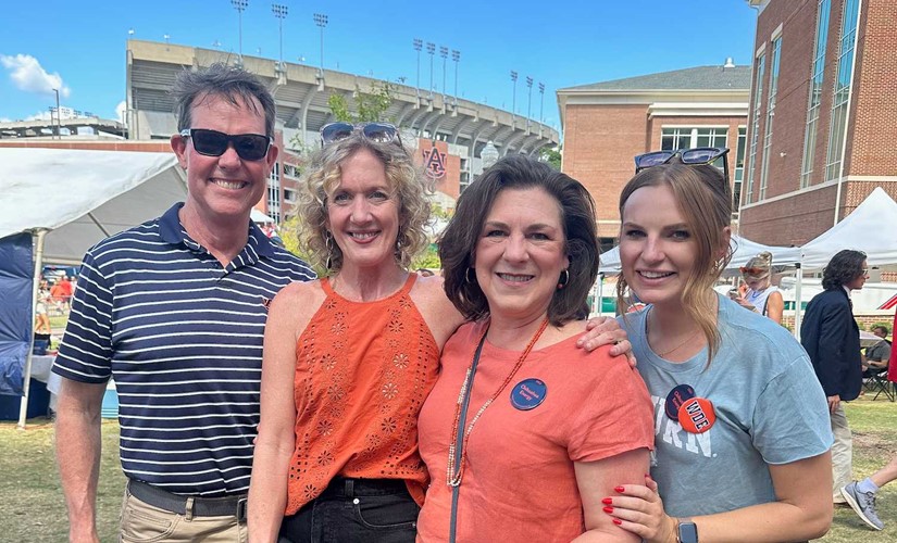 alumni and faculty at tailgate