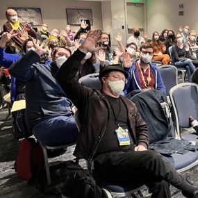 Big Bad Con attendees waving to the camera