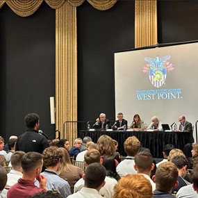 Student asking question to a panel at the Student Conference on U.S. Affairs at West Point