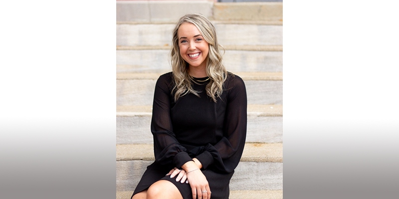 Hannah McGill sitting on steps