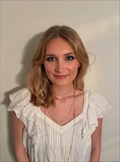 photo of light hair woman in white shirt against white background