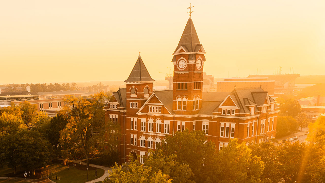 Samford Hall and lawn at sunset