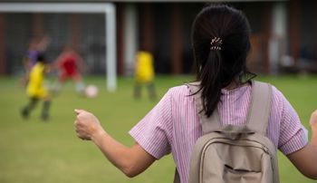 Frustrated mother watching a youth soccer game