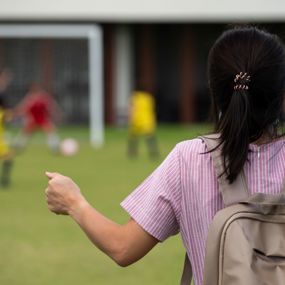 Frustrated mother watching a youth soccer game