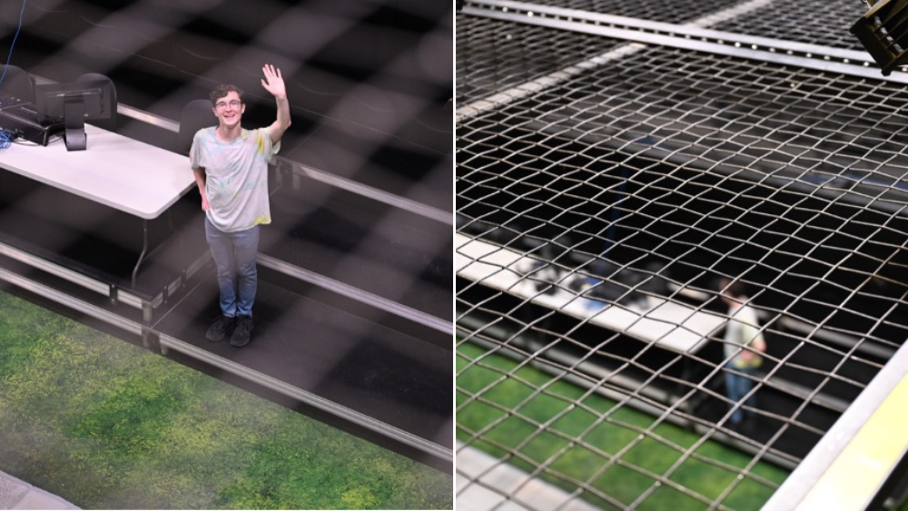 Wil Eplett observing the Black Box space, seen through the tension grid.