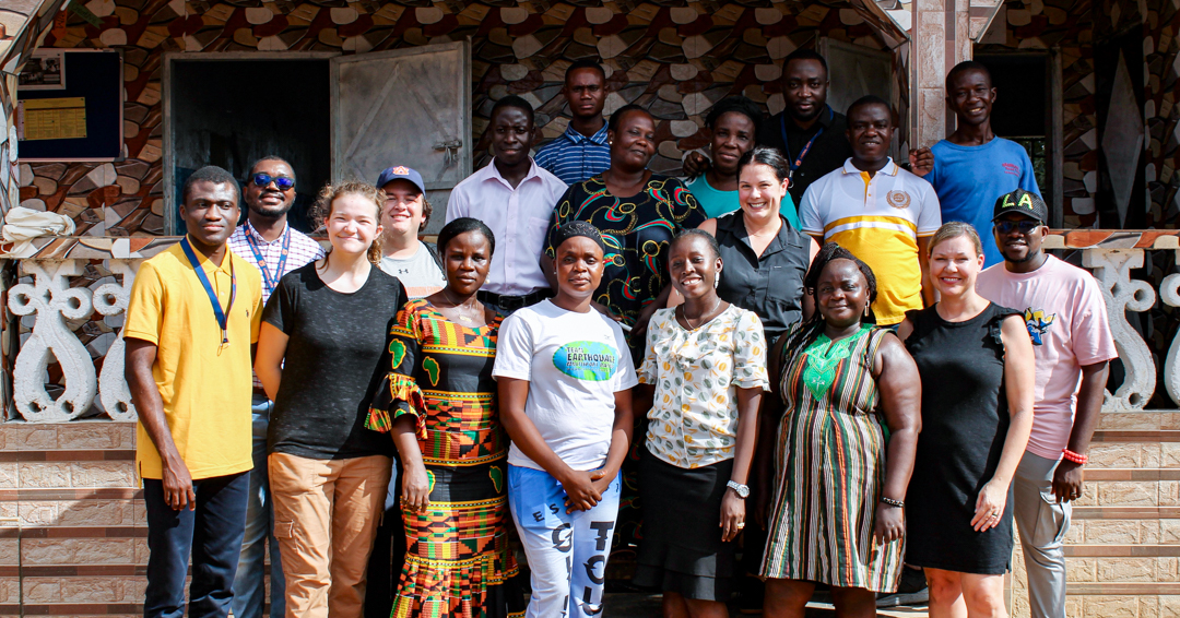Faculty, graduate students and international partners of the Global Development Solutions Lab taking a group photo in Africa