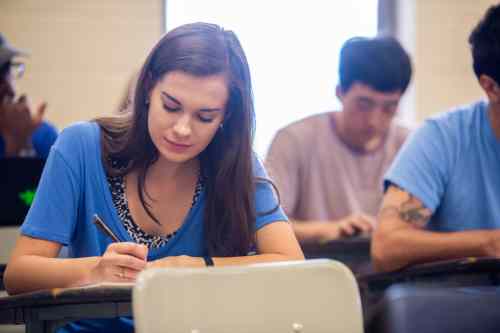 Girl writing at her desk