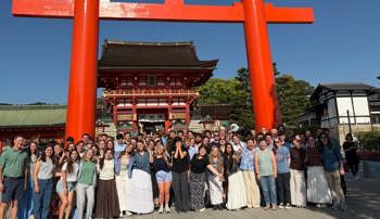 Auburn Symphonic Winds members posing for a group photo in Japan