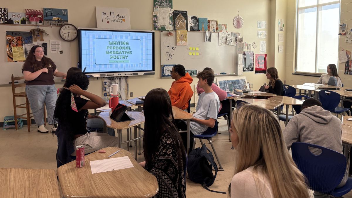 Abigail Bowling teaching a high school class on how to write personal narrative poetry.