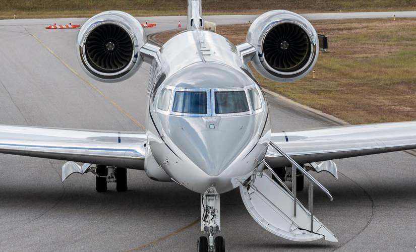 corporate jet sitting on a runway