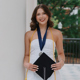 Grace Miles holding a graduation cap
