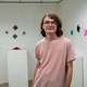 Collin Crowder with work on display in Biggin Hall