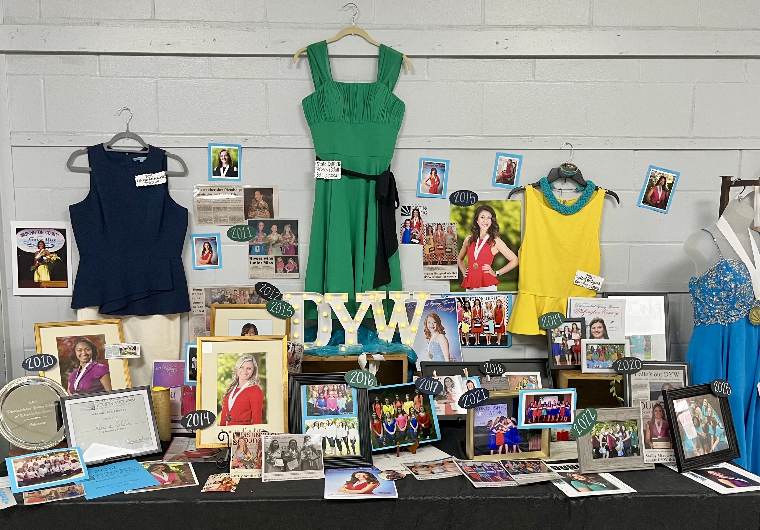 A colorful display of programs, pictures, and attire adorn a celebratory table