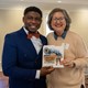 Author and illustrator holding copy of the Betsey Scott Harper children's book