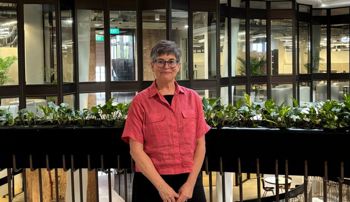 Arianne Gaetano standing in a lobby in a building in Singapore
