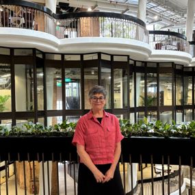Arianne Gaetano standing in a lobby in a building in Singapore