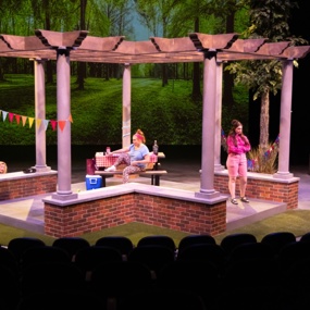 Brick and wood pavilion on a theatre stage 
