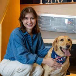 Marianna Spiotta and dog posing for a photo