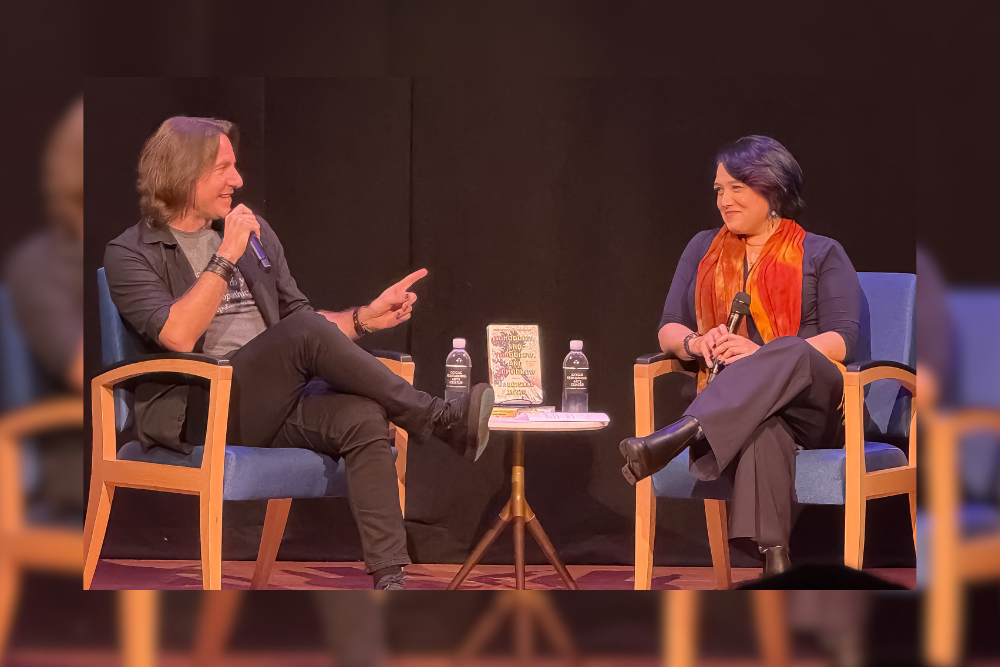 Matthew Mercer and Emily Friedman speaking on stage 