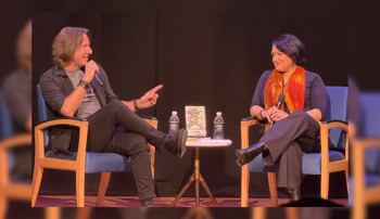 Matthew Mercer and Emily Friedman speaking on stage 