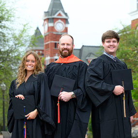 Abbey, Jamie and Avery Heath in graduation caps and gowns