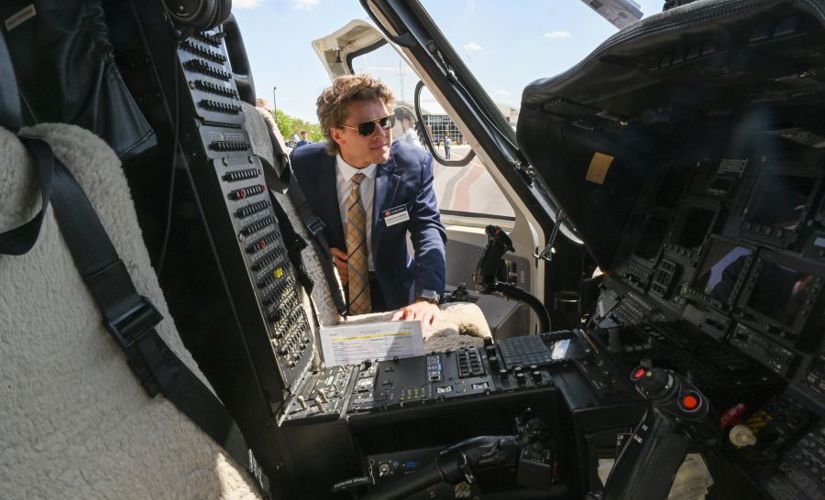 man looking at the cockpit of a plane