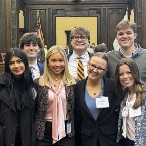 Auburn students posing for a photo inside the US Court of Appeals courtroom