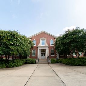 Cary Hall under a bright blue sky