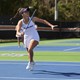Taylor Russo playing tennis on the Auburn University team