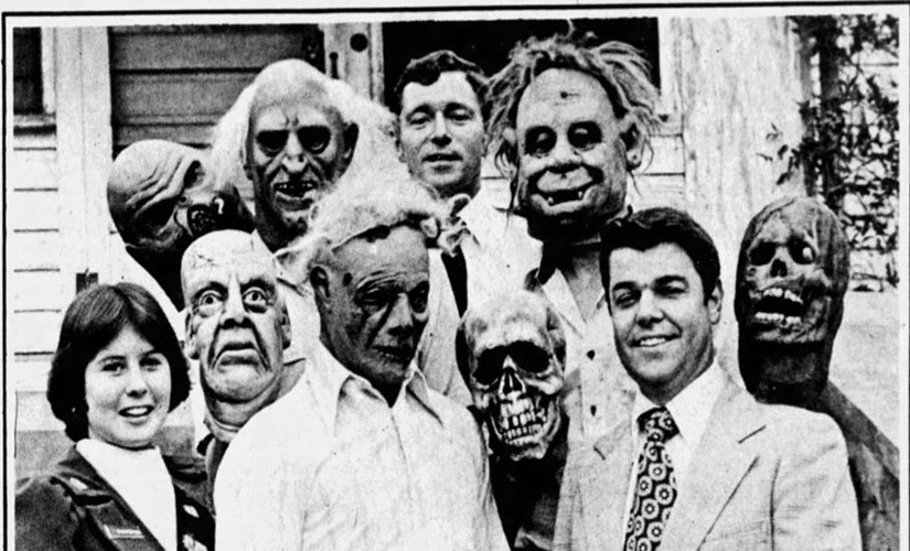 Auburn students in Halloween masks presenting the March of Dimes with a check