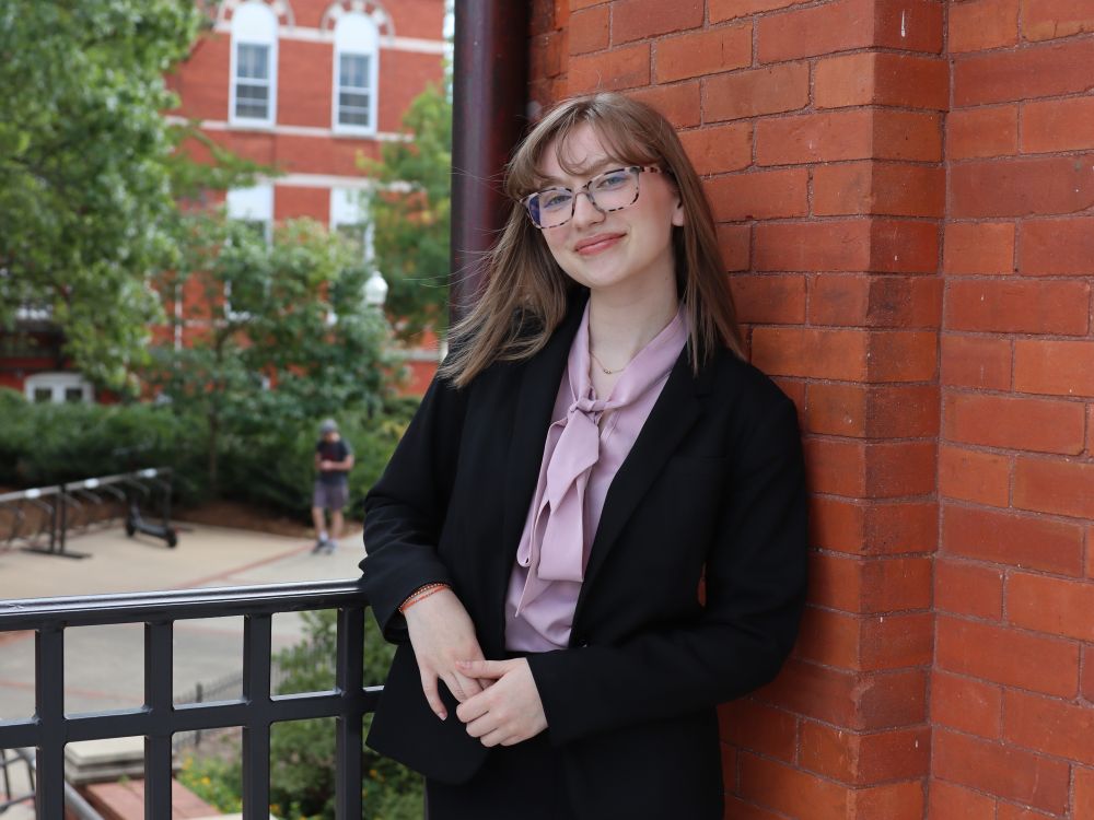 Maggie Haggerty in business attire posing for a photo on Auburn's campus