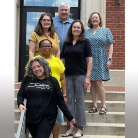 Writing retreat participants pose for a photo on the Tichenor Hall steps