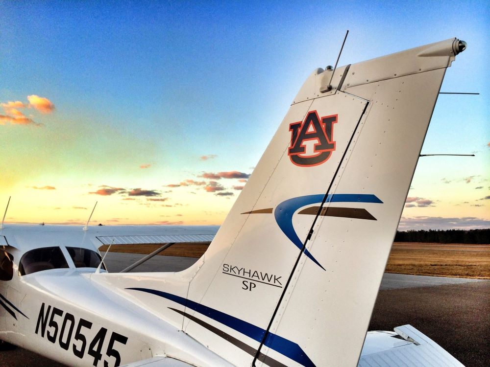 An airplane with an Auburn University logo