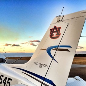 An airplane with an Auburn University logo