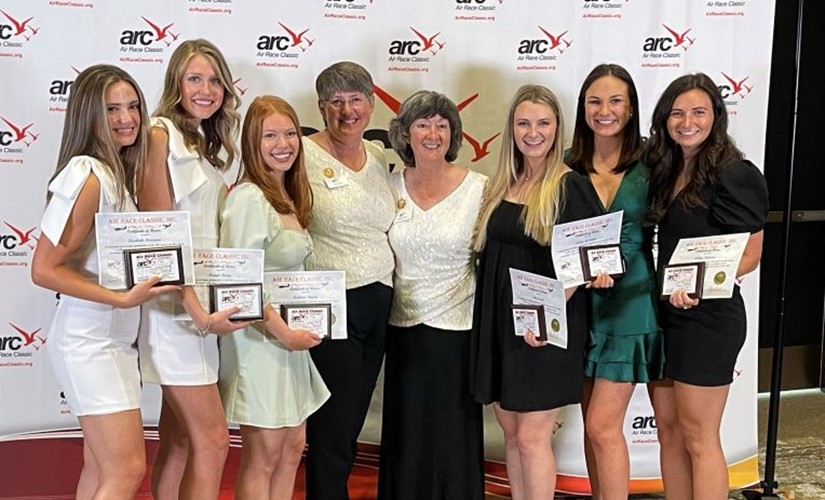 The War Eagle Women stand with awards at the Air Race Classic banquet