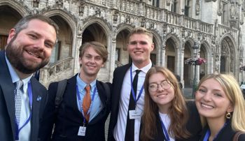 Matt Clary and students outside the Brussels Forum