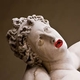 statue of antiquity with red lips